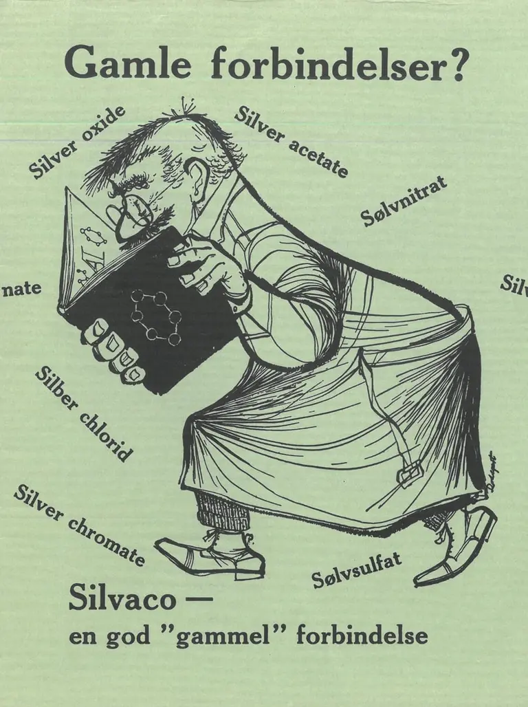 Green card with a drawing of a hunched chemist reading a book, surrounded by the names of silver compounds